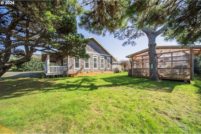 view of yard with a sunroom