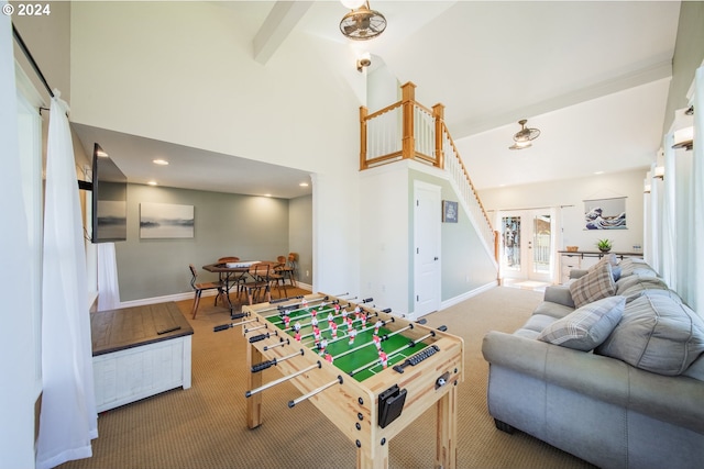 playroom with carpet, beamed ceiling, and high vaulted ceiling