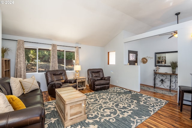 living room featuring ceiling fan, vaulted ceiling, and dark hardwood / wood-style flooring