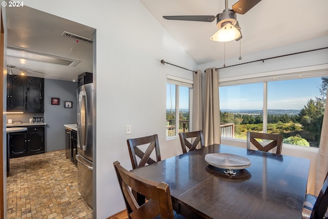 dining room featuring lofted ceiling and ceiling fan