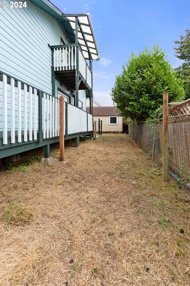 view of yard with a wooden deck