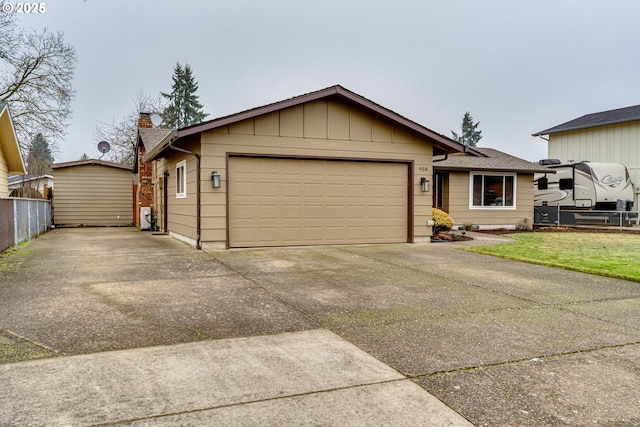 ranch-style home with a front yard and a garage