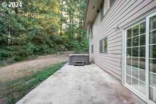 view of property exterior featuring a patio area