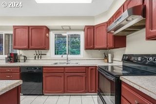 kitchen with light tile patterned flooring, black appliances, and sink