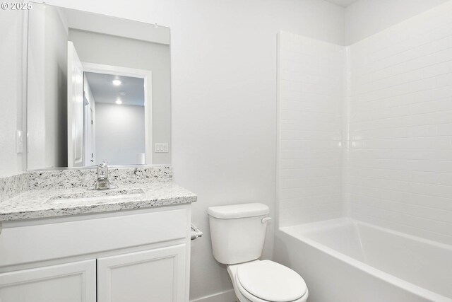 full bathroom with bathing tub / shower combination, toilet, and vanity