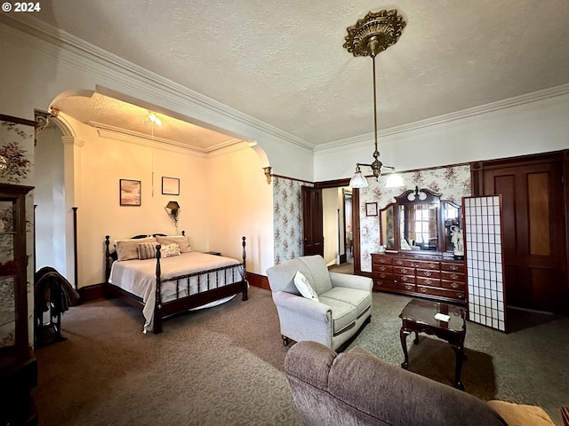 bedroom featuring carpet flooring, a textured ceiling, and ornamental molding