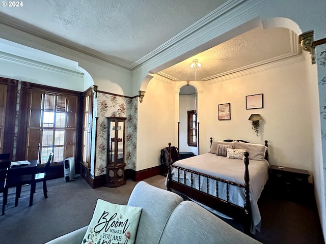 bedroom with carpet flooring, crown molding, and a textured ceiling