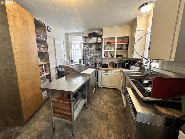 kitchen with sink and ornamental molding