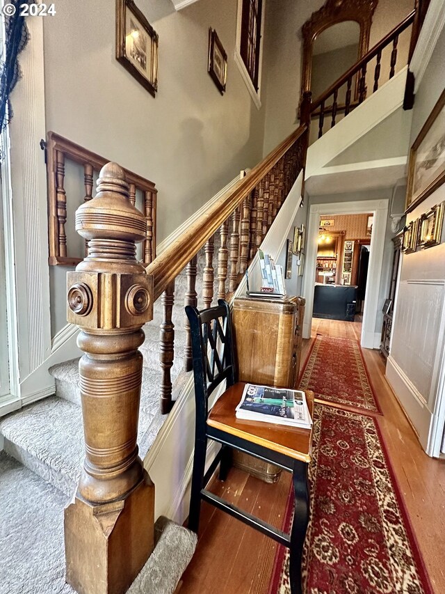 stairway featuring hardwood / wood-style floors