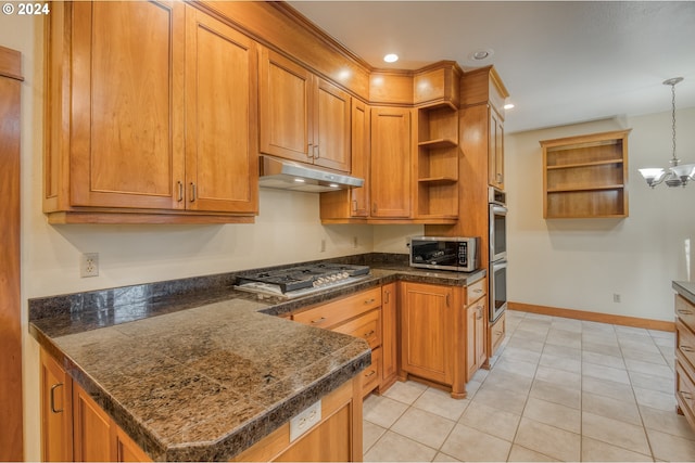 kitchen with stainless steel appliances, kitchen peninsula, a chandelier, decorative light fixtures, and light tile patterned flooring