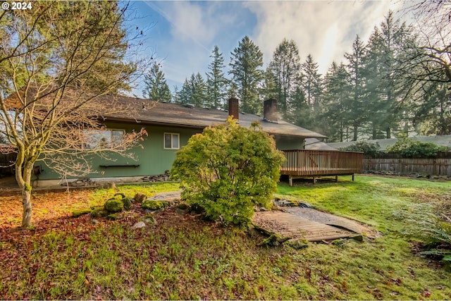 exterior space with a lawn and a deck