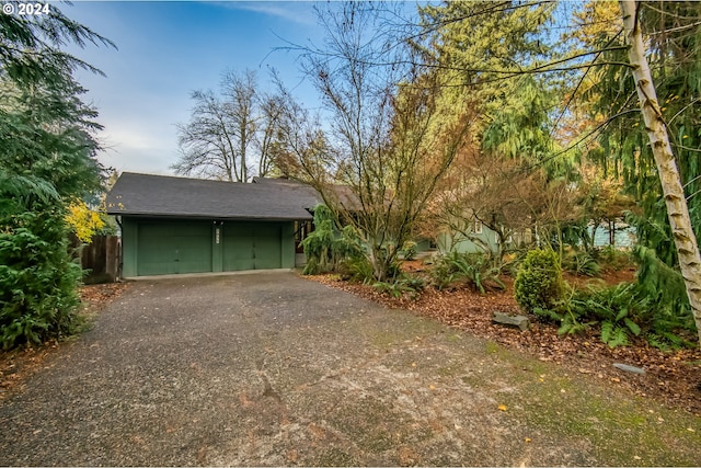 view of property exterior featuring a garage