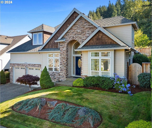 craftsman-style house with a garage and a front yard