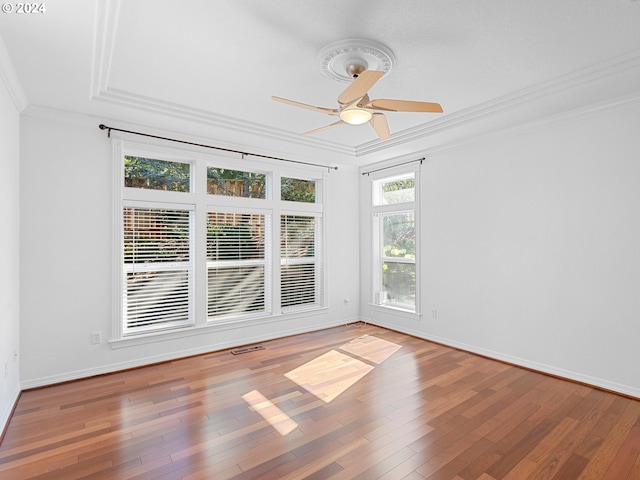 unfurnished room featuring hardwood / wood-style floors, ceiling fan, and ornamental molding