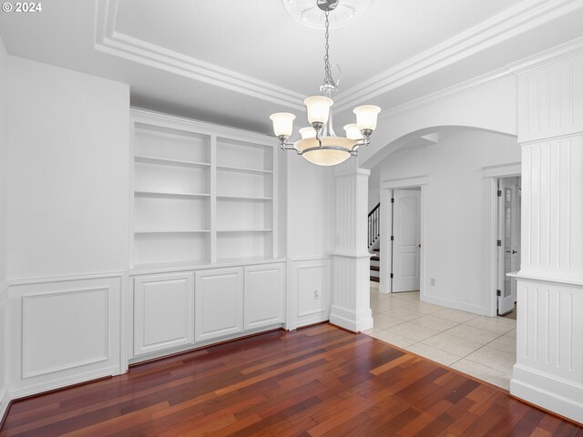 hall with vaulted ceiling, light hardwood / wood-style flooring, and crown molding