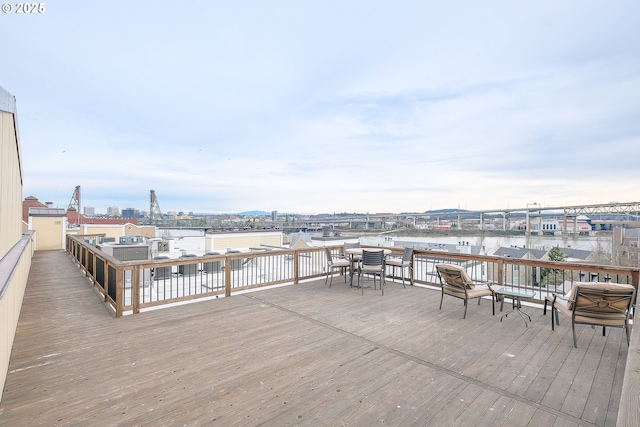 wooden deck with a water view