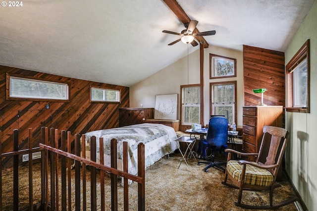 carpeted bedroom featuring wooden walls, lofted ceiling, and multiple windows