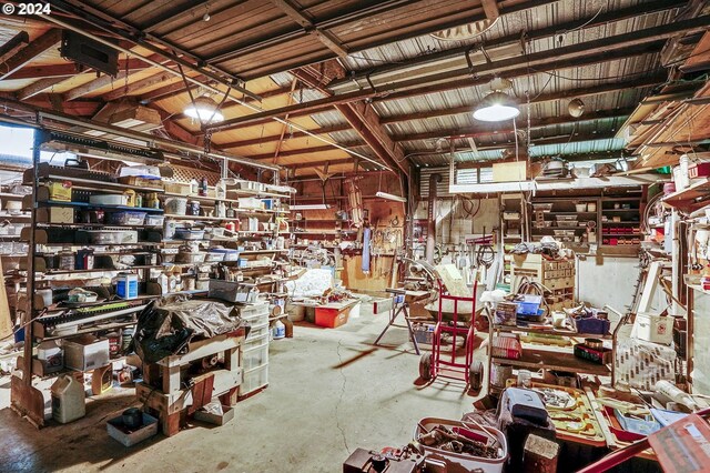 misc room with concrete floors and a workshop area