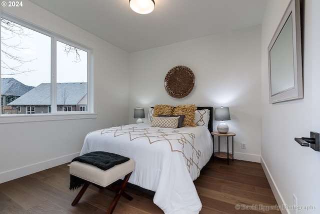 bedroom featuring dark hardwood / wood-style flooring