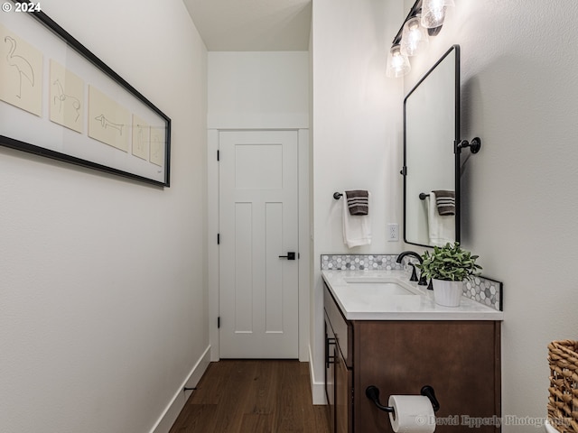 bathroom with vanity and hardwood / wood-style flooring