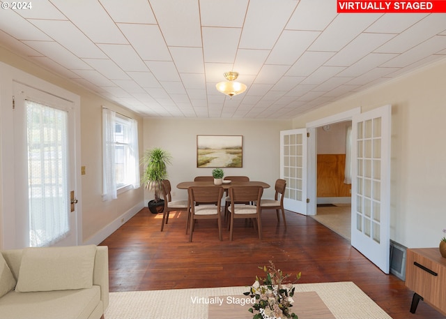 dining room with french doors and dark hardwood / wood-style floors