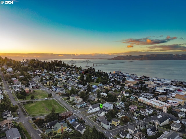 aerial view at dusk with a water view