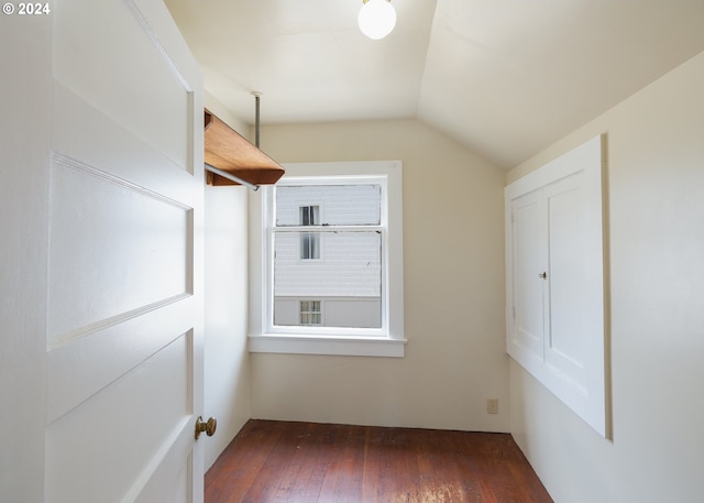 bonus room with lofted ceiling and dark hardwood / wood-style flooring