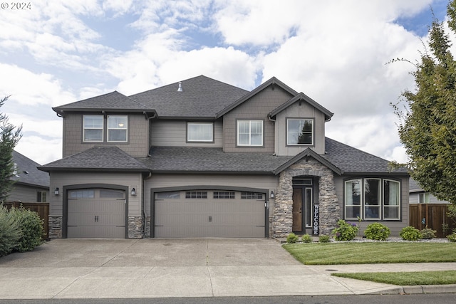 view of front of house with a front lawn and a garage