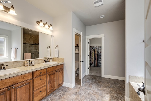 full bathroom featuring toilet, shower with separate bathtub, vanity, and tile patterned floors