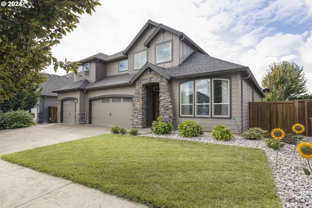 view of front facade featuring a garage and a front yard