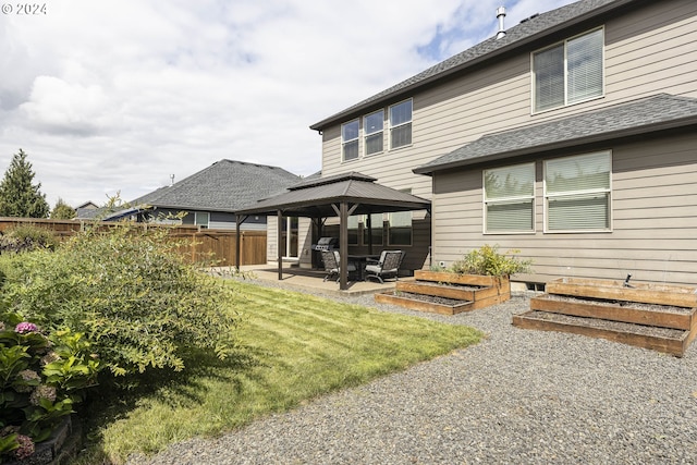 back of property featuring a yard and a patio