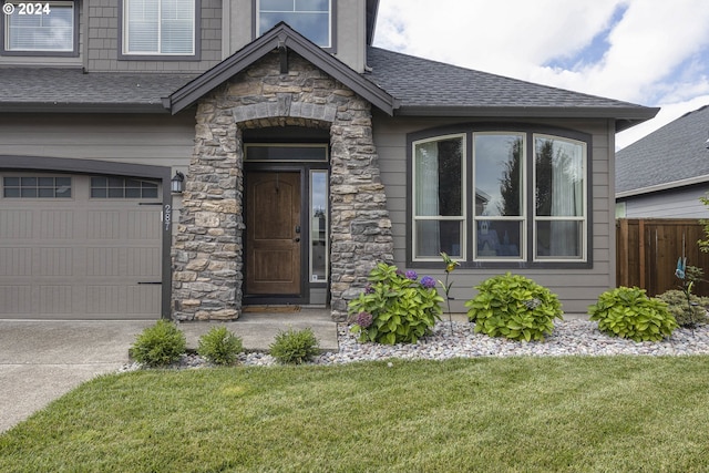 property entrance featuring a lawn