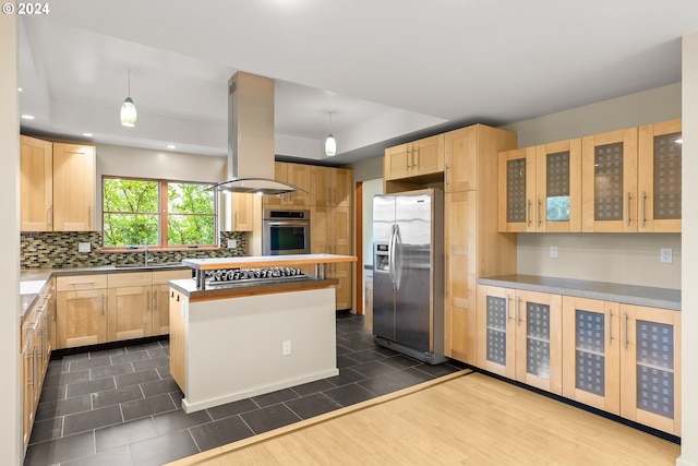 kitchen featuring a kitchen island, appliances with stainless steel finishes, dark hardwood / wood-style flooring, light brown cabinetry, and island range hood