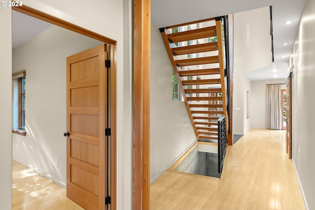 staircase featuring hardwood / wood-style flooring