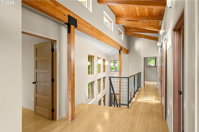 hallway featuring high vaulted ceiling, wooden ceiling, beamed ceiling, and wood-type flooring