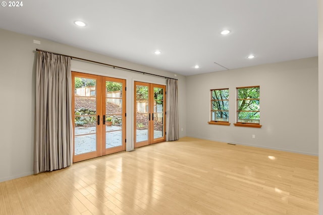 interior space featuring french doors and light wood-type flooring