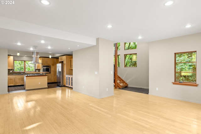 unfurnished living room featuring light hardwood / wood-style floors