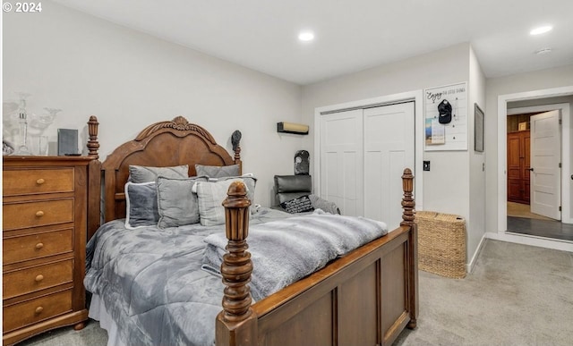 bedroom featuring a closet and light carpet