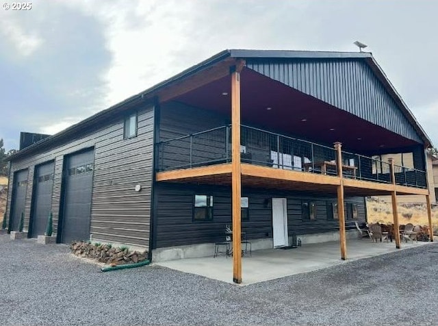 view of side of home with a patio area