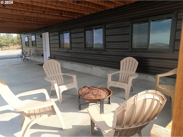 view of patio with an outdoor fire pit