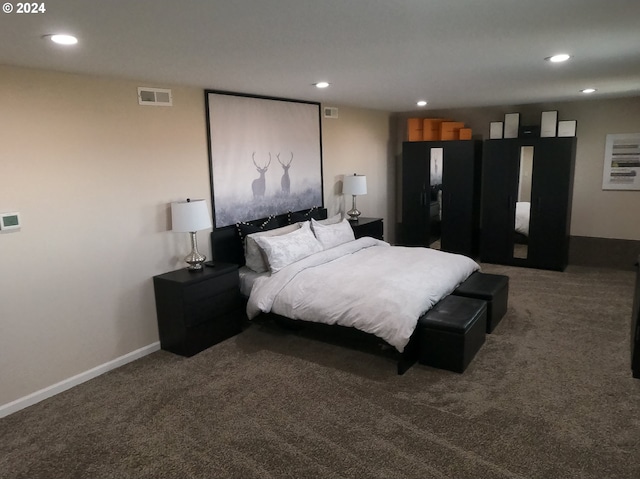 bedroom with dark carpet