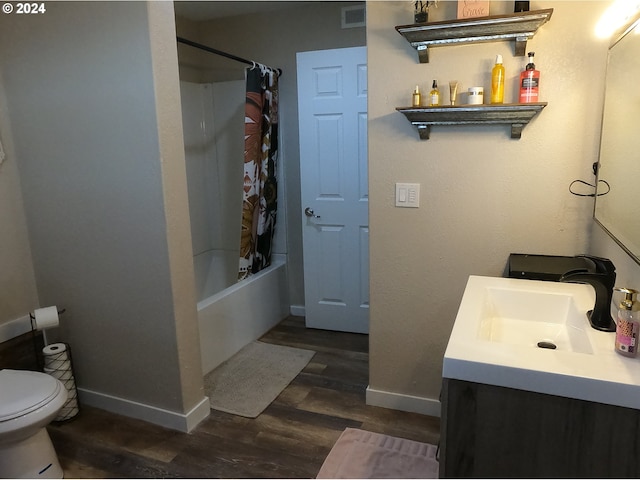 full bathroom with shower / tub combo with curtain, wood-type flooring, toilet, and vanity