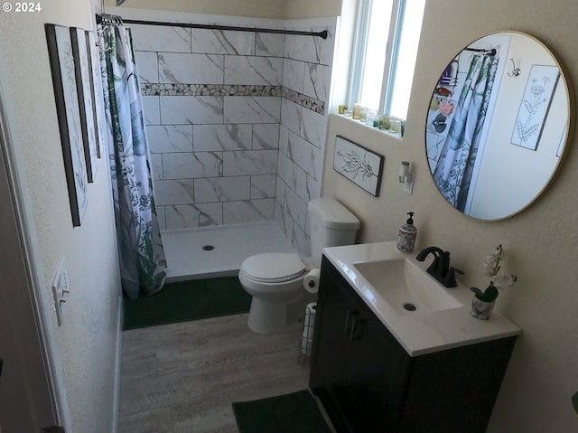 bathroom with vanity, hardwood / wood-style flooring, toilet, and a shower with shower curtain