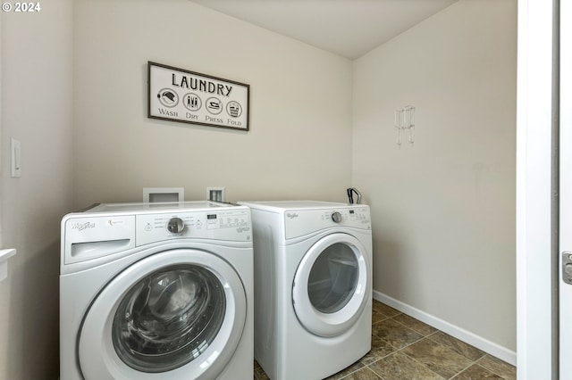 laundry area with washing machine and clothes dryer