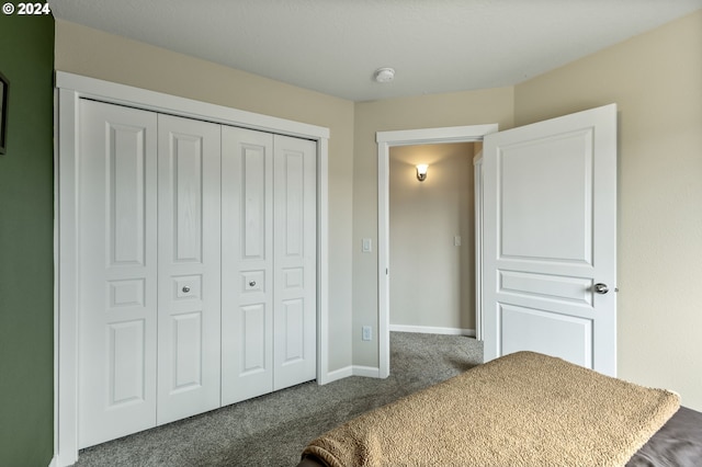 carpeted bedroom with a closet