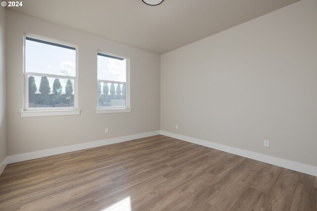 20542 Empire Ave, Bend, OR 97701 - unfurnished room featuring light wood-style floors and baseboards