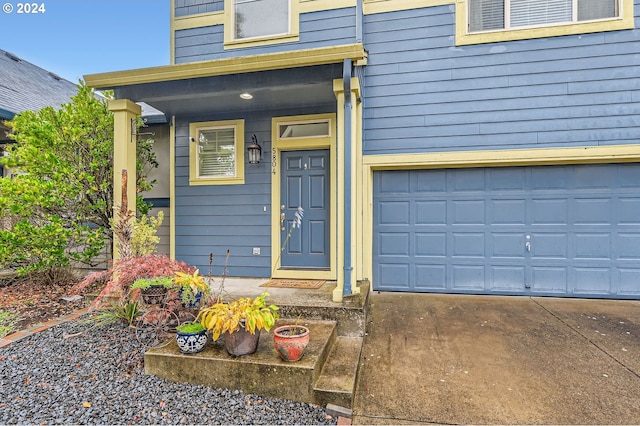 doorway to property featuring a garage