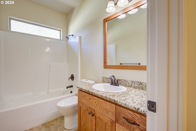 full bathroom featuring washtub / shower combination, vanity, tile patterned flooring, and toilet