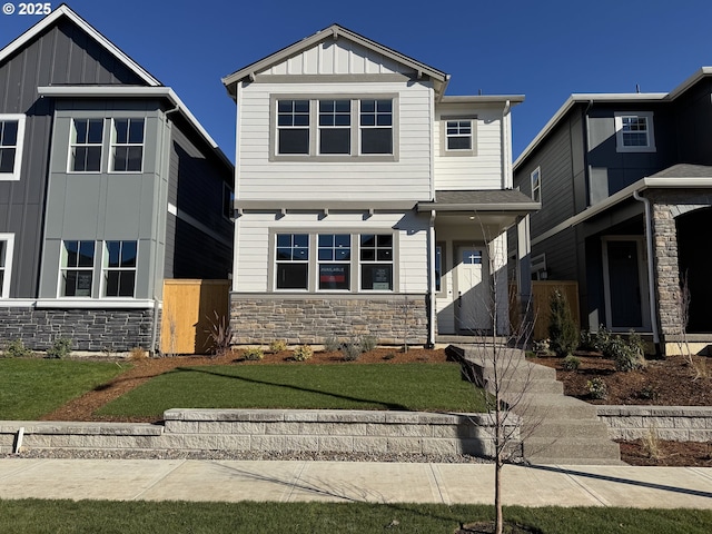 craftsman-style house with board and batten siding and stone siding