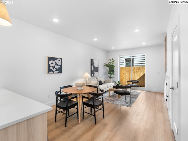 dining area with light hardwood / wood-style flooring